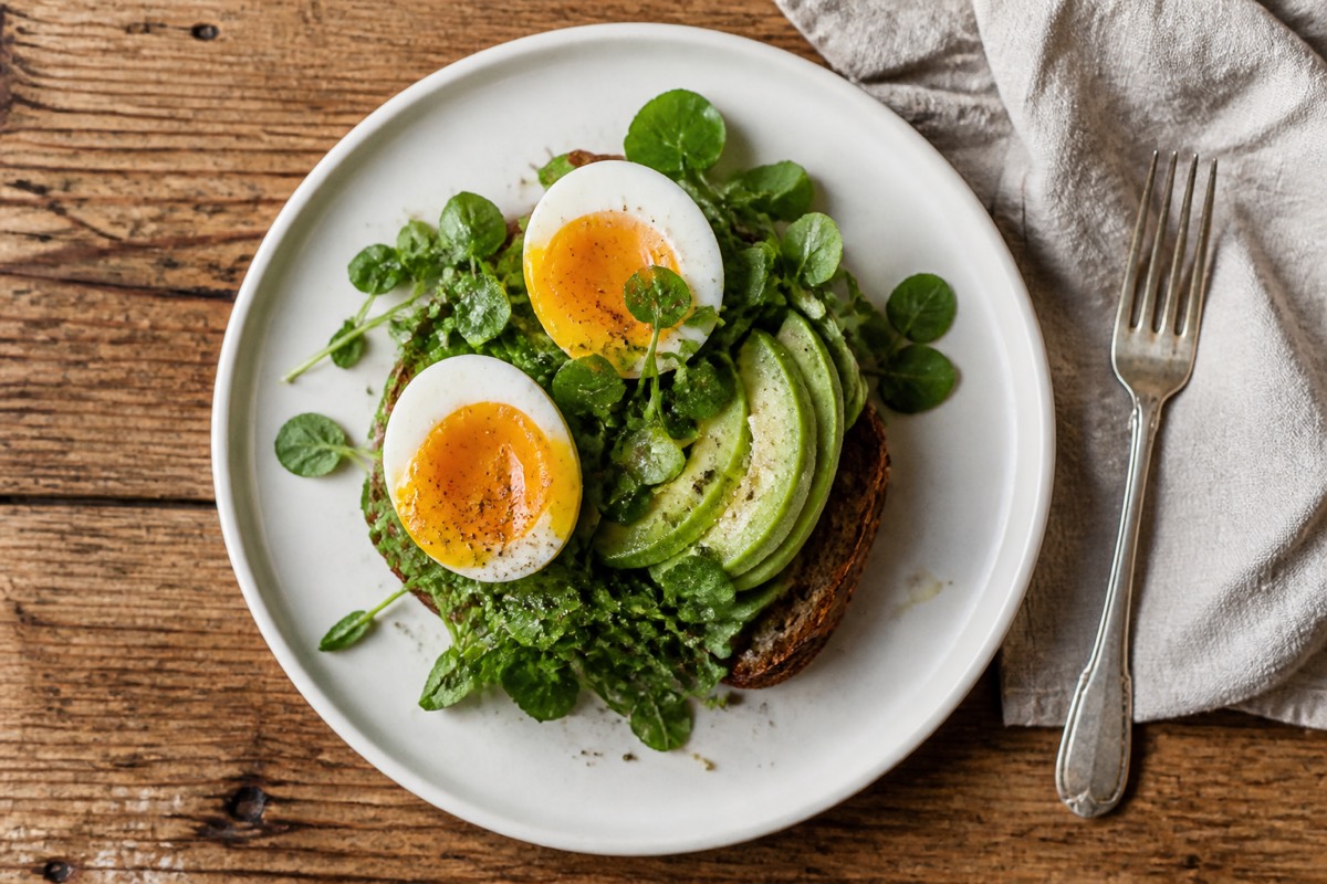 Soft eggs, avocado & watercress on rye