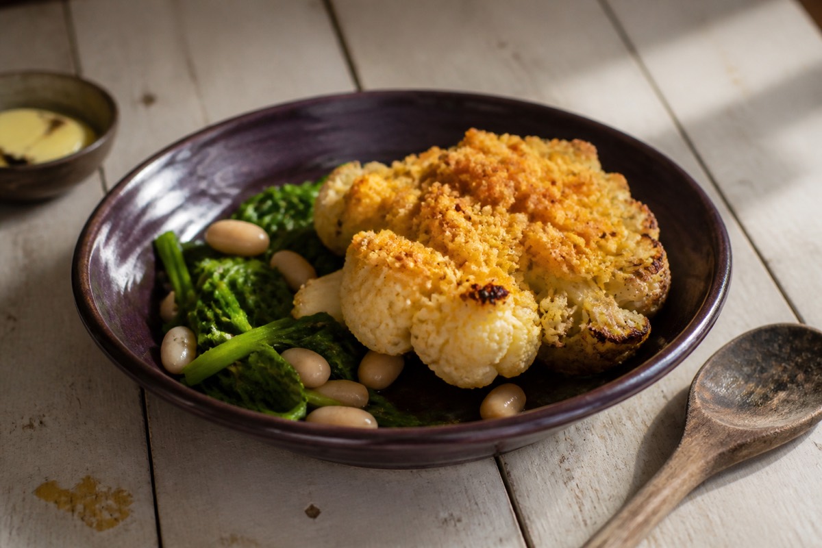 Roast cauliflower steaks with cheddar crumb & greens