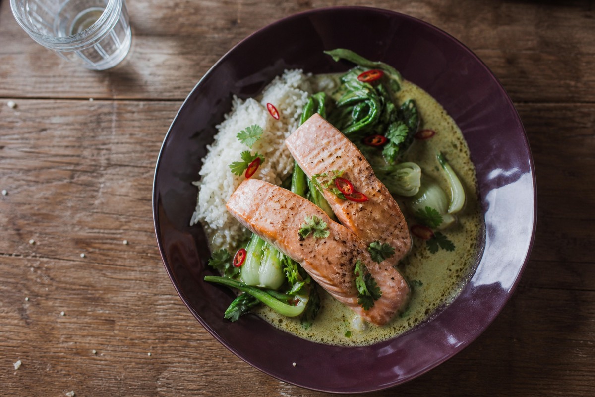 Salmon in green curry sauce with greens